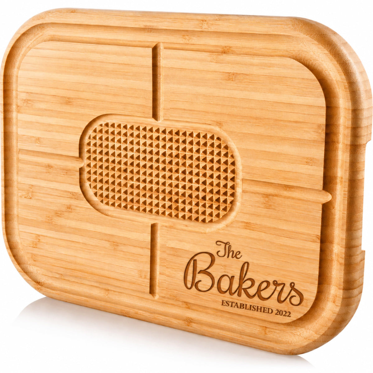 Personalized meat carving board engraved with a family name