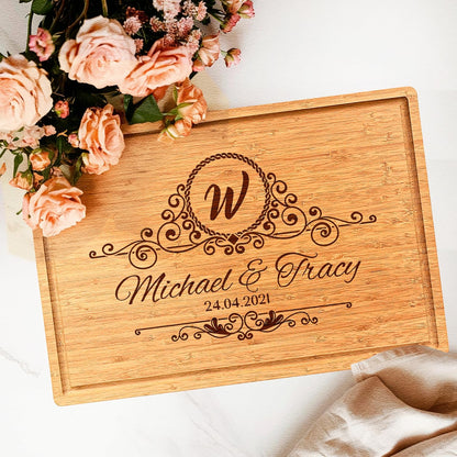 Personalized bamboo cutting board engraved with names